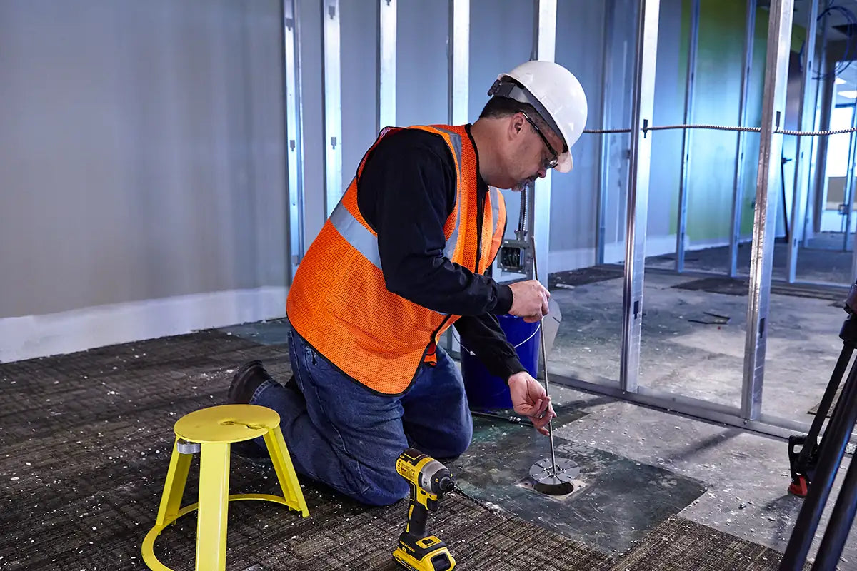 Contractor seating a HoleMole in a cored floor slab