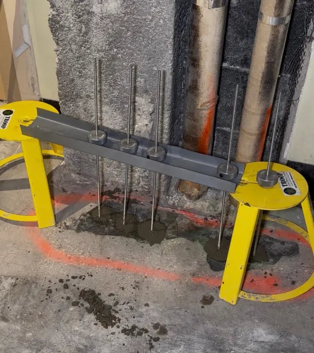 Multiple HoleMoles set on a reinforcing-bar jig on a Troop Contracting jobsite